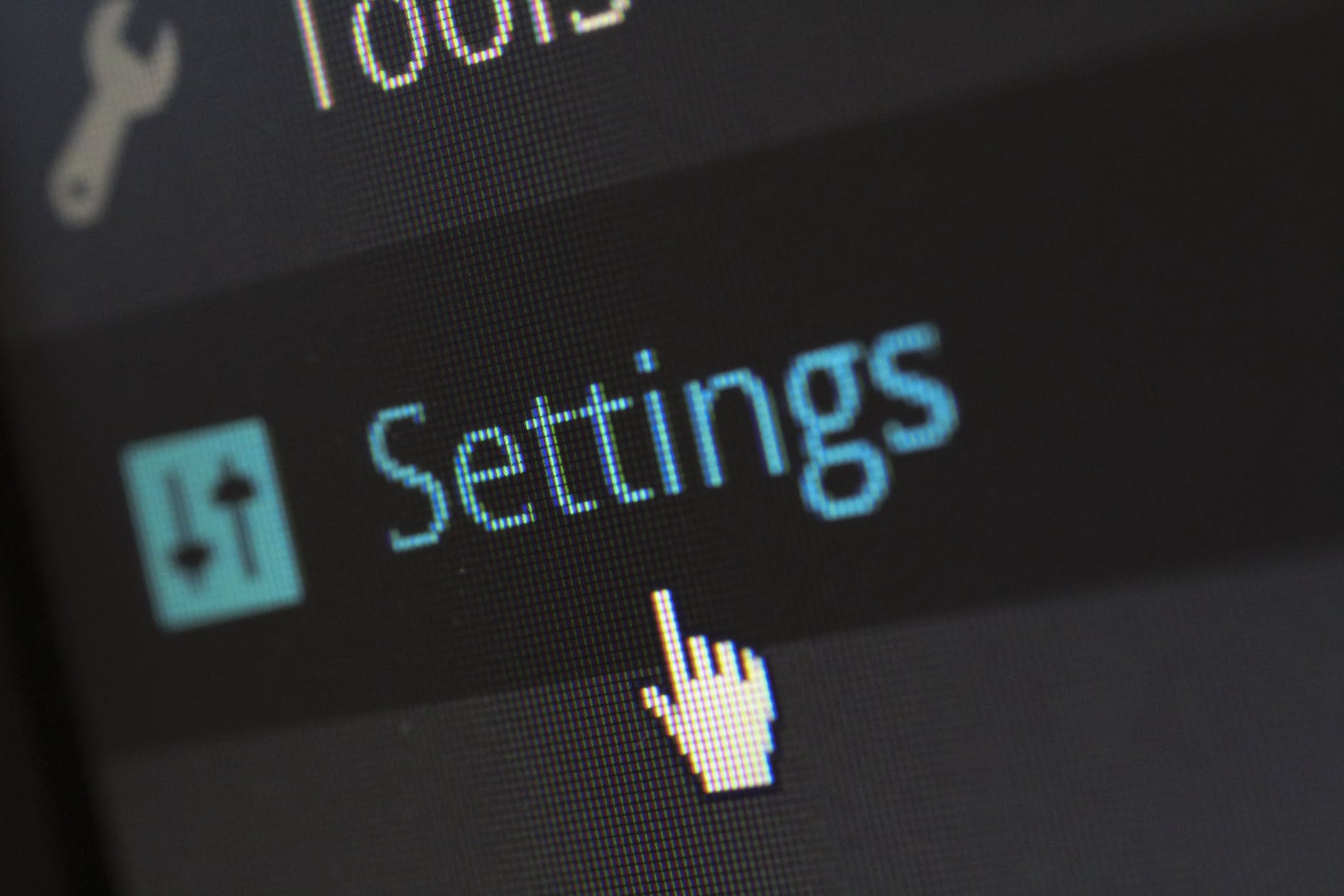 A computer mouse hovering over the word settings to remind people to adjust security settings and share files safely.